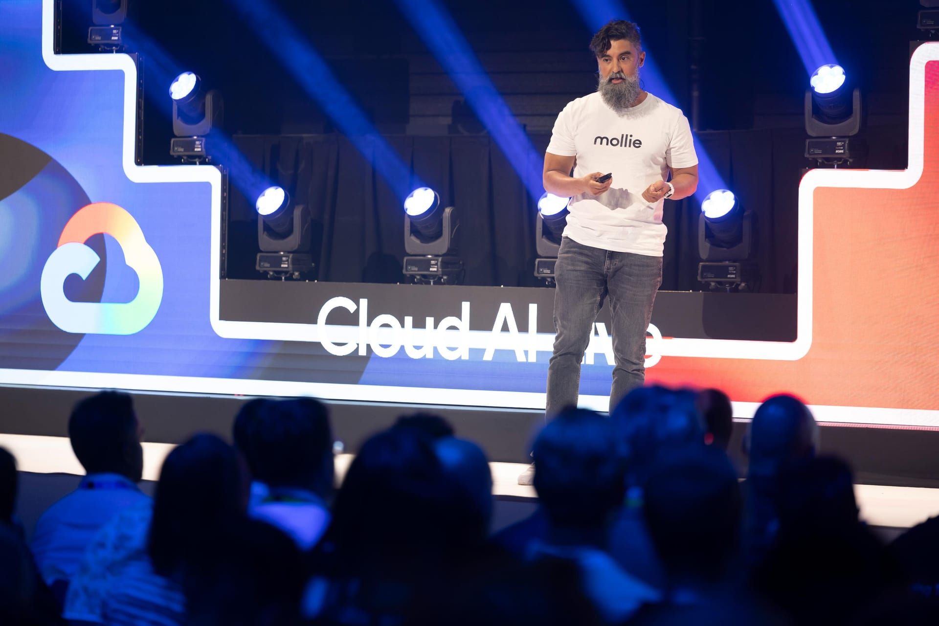 Ryan Chaves presenting on stage at the Google Cloud AI Live conference in Amsterdam.
